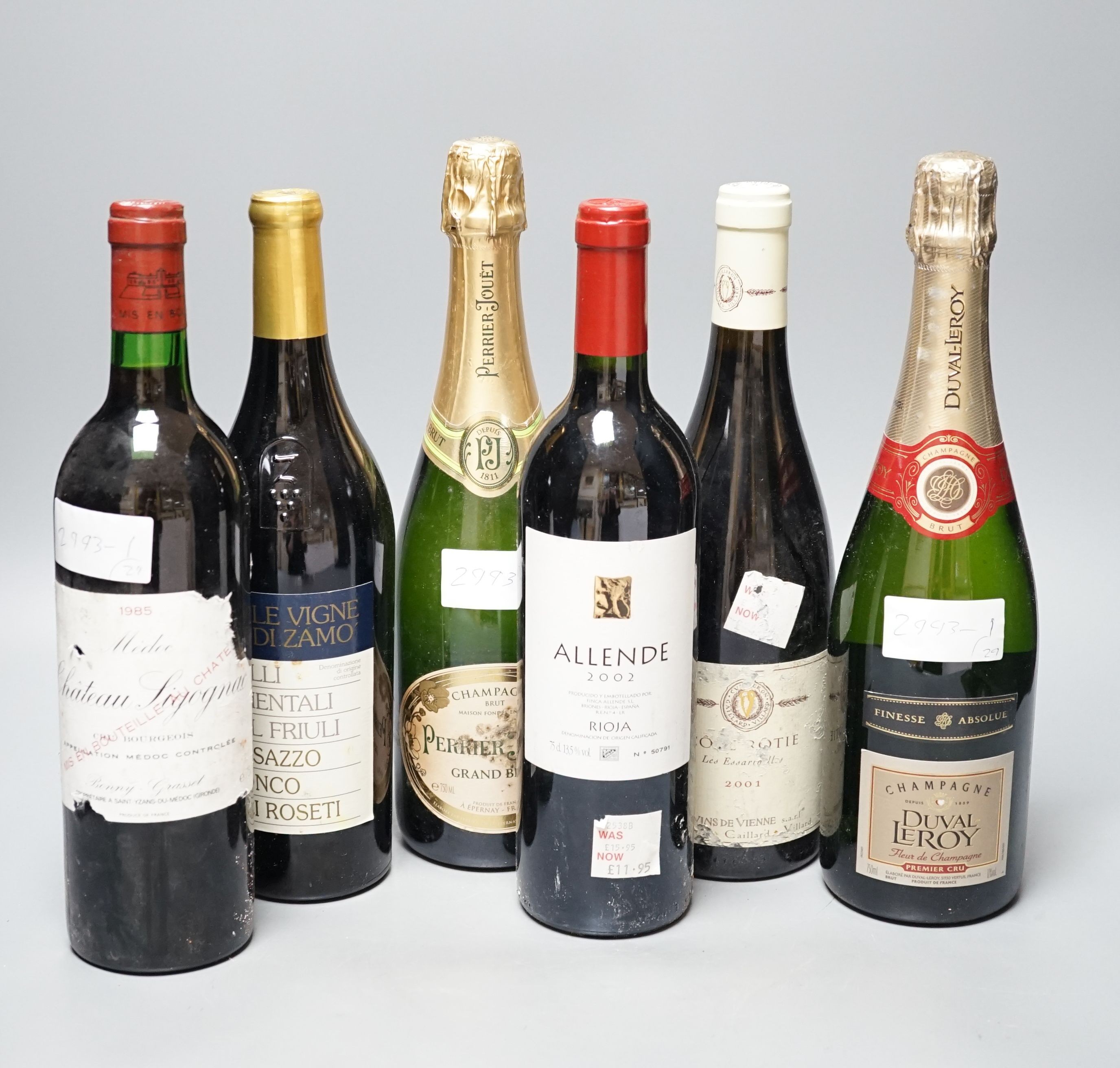 Twenty nine assorted bottles of wine is etc. including Les Tourelles de Longueville, 2003, Chateau Fourcas Dupre, 2000, Perrier Jouet Grand Brut Champagne, Chateau Sigognac, 1985 and Cote Rotie, 2001.